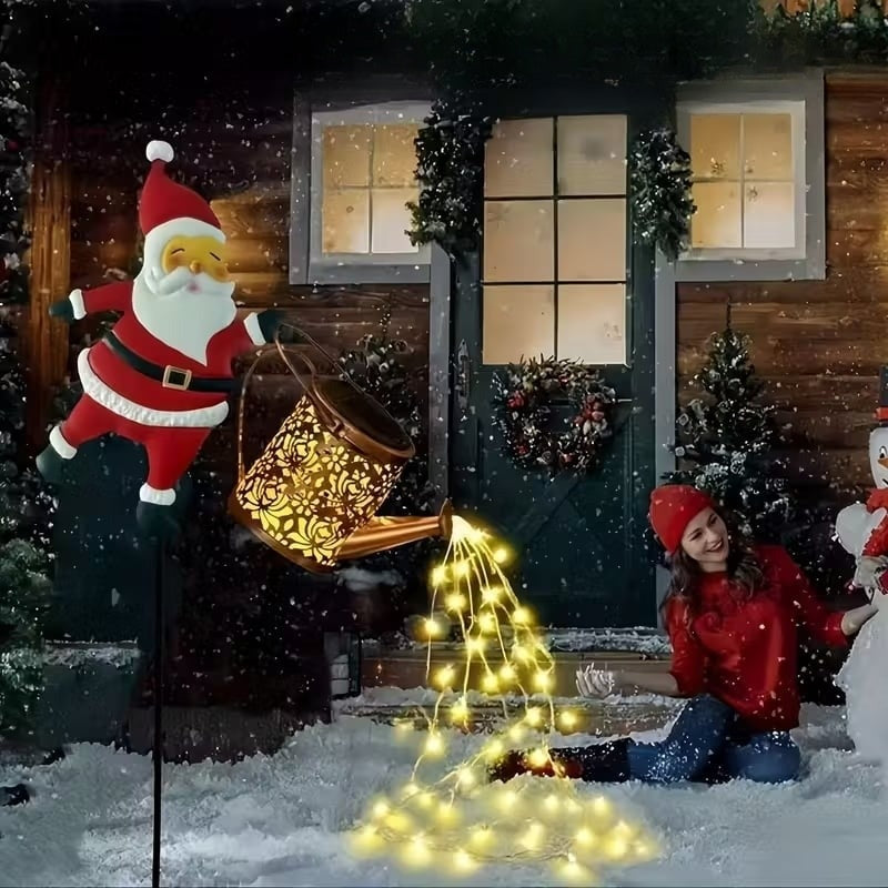 Kerstman-gieter met zonnepaneel en grondpen